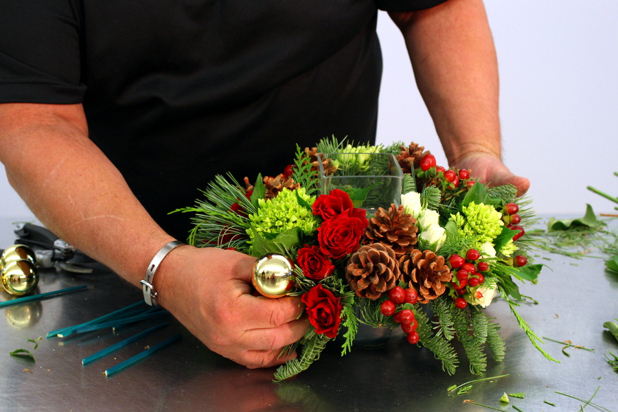 Add ornaments to Christmas centerpiece